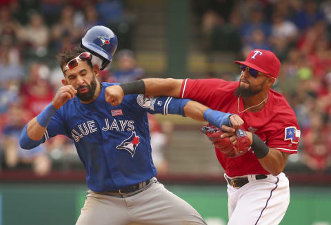 Toronto Blue Jays Jose Bautista (19) gets hit by Texas Rangers second baseman Rougned Odor (12) after Bautista slid into second in the 8th inning at Globe Life Park on May 15, 2016 in Arlington, Texas. The Rangers won 7-6. (Richard W. Rodriguez/Fort Worth Star-Telegram/TNS via Getty Images)