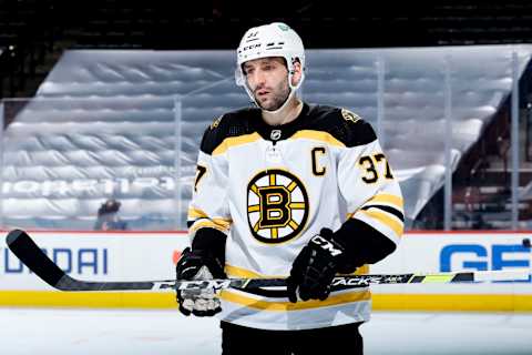 PHILADELPHIA, PENNSYLVANIA – FEBRUARY 05: Patrice Bergeron #37 of the Boston Bruins looks on during the third period against the Philadelphia Flyers at Wells Fargo Center on February 05, 2021 in Philadelphia, Pennsylvania. Bergeron was playing in his 1,100th NHL game. (Photo by Tim Nwachukwu/Getty Images)