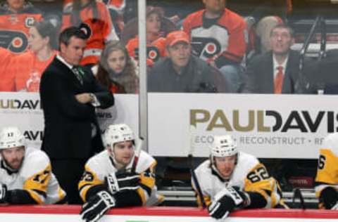 PHILADELPHIA, PA – APRIL 18: Head Coach of the Pittsburgh Penguins Mike Sullivan looks on during the first period behind Bryan Rust #17, Conor Sheary #43 and Carl Hagelin #62 against the Philadelphia Flyers in Game Four of the Eastern Conference First Round during the 2018 NHL Stanley Cup Playoffs at the Wells Fargo Center on April 18, 2018 in Philadelphia, Pennsylvania. (Photo by Len Redkoles/NHLI via Getty Images)