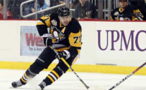 Dec 31, 2016; Pittsburgh, PA, USA; Pittsburgh Penguins center Evgeni Malkin (71) skates with the puck against the Montreal Canadiens during the third period at the PPG PAINTS Arena. The Pens won 4-3 in overtime. Mandatory Credit: Charles LeClaire-USA TODAY Sports