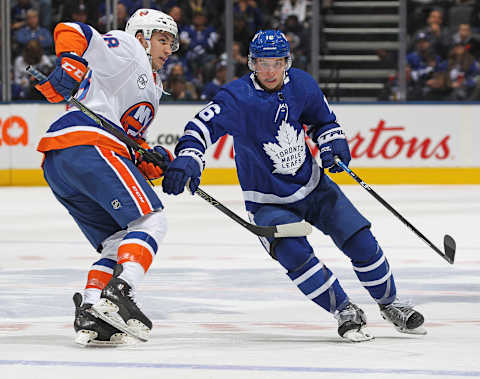 TORONTO, ON – DECEMBER 29: Michael Dal Colle #28 of the New York Islanders skates against Mitchell Marner #16 of the Toronto Maple Leafs during an NHL game at Scotiabank Arena on December 29, 2018 in Toronto, Ontario, Canada. The Islanders defeated the Maple Leafs 4-0.(Photo by Claus Andersen/Getty Images)