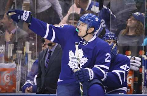 NHL Trade Rumors: Toronto Maple Leafs left wing James van Riemsdyk (25) motions from the bench during the game in which he scored a hat trick against the Nashville Predators at Air Canada Centre. The Maple Leafs defeated the Predators 6-2. Mandatory Credit: Tom Szczerbowski-USA TODAY Sports