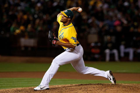 OAKLAND, CA – SEPTEMBER 22: Jeurys Fammilia #32 of the Oakland Athletics pitches against the Minnesota Twins during the seventh inning at the Oakland Coliseum on September 22, 2018 in Oakland, California. The Oakland Athletics defeated the Minnesota Twins 3-2. (Photo by Jason O. Watson/Getty Images)