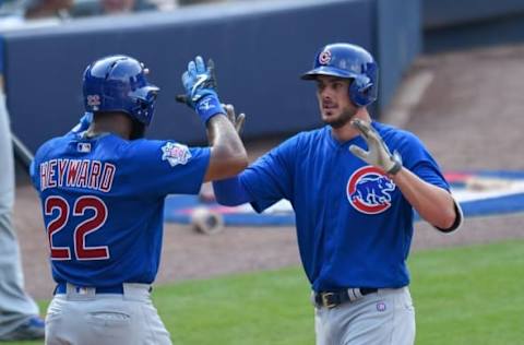 Jun 11, 2016; Atlanta, GA, USA; Chicago Cubs third baseman Kris Bryant (17) high fives right fielder Jason Heyward (22) after hitting a home run against the Atlanta Braves during the fifth inning at Turner Field. The Cubs defeated the Braves 8-2. Mandatory Credit: Dale Zanine-USA TODAY Sports