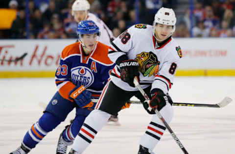 Chicago Blackhawks forward Patrick Kane (88) keeps the puck from Edmonton Oilers forward Ryan Nugent-Hopkins (93) Mandatory Credit: Perry Nelson-USA TODAY Sports