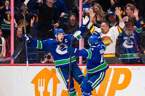 Mar 11, 2022; Vancouver, British Columbia, CAN; Vancouver Canucks forward Bo Horvat (53) and defenseman Quinn Hughes (43) celebrate HorvatÕs second goal of the game against the Washington Capitals in the third period at Rogers Arena. Capitals won 4-3 in overtime. Mandatory Credit: Bob Frid-USA TODAY Sports