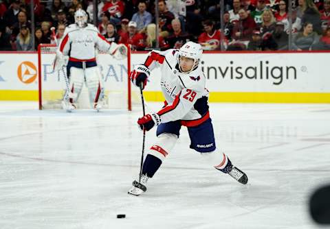 RALEIGH, NC – DECEMBER 28: Christian Djoos #29 of the Washington Capitals passes the puck during an NHL game against the Carolina Hurricanes on December 28, 2019 at PNC Arena in Raleigh, North Carolina. (Photo by Gregg Forwerck/NHLI via Getty Images)