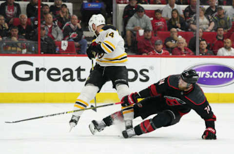 RALEIGH, NC – MAY 14: Carolina Hurricanes defenseman Jaccob Slavin (74) defends a shot by Boston Bruins right wing Chris Wagner (14) during a game between the Boston Bruins and the Carolina Hurricanes on May 14, 2019 at the PNC Arena in Raleigh, NC. (Photo by Greg Thompson/Icon Sportswire via Getty Images)