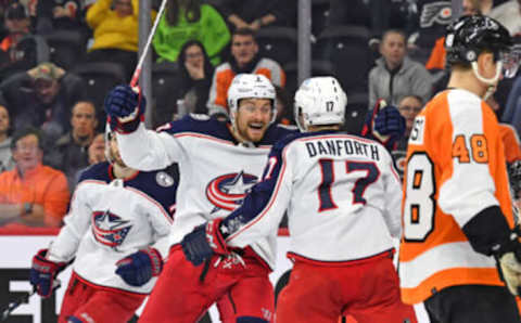 Apr 5, 2022; Philadelphia, Pennsylvania, USA; Columbus Blue Jackets right wing Justin Danforth (17) celebrates his goal with center Sean Kuraly (7) against the Philadelphia Flyers during the third period at Wells Fargo Center. Mandatory Credit: Eric Hartline-USA TODAY Sports