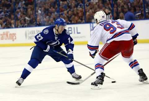 Dec 30, 2015; Tampa, FL, USA; Tampa Bay Lightning left wing Jonathan Drouin (27) skates with the puck as New York Rangers defenseman Keith Yandle (93) during the second period at Amalie Arena. Mandatory Credit: Kim Klement-USA TODAY Sports