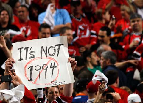 A fan of the New Jersey Devils holds up a sign. (Photo by Bruce Bennett/Getty Images)