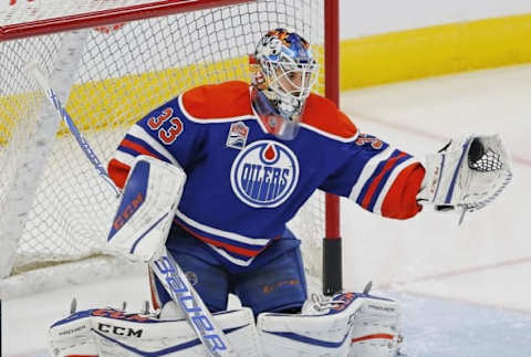 Nov 13, 2016; Edmonton, Alberta, CAN; Edmonton Oilers goaltender Cam Talbot (33) makes a save during warmup against the New York Rangers at Rogers Place. Mandatory Credit: Perry Nelson-USA TODAY Sports