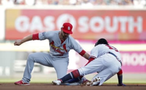 Paul DeJong of the St. Louis Cardinals completes a tag play. (Photo by Todd Kirkland/Getty Images)