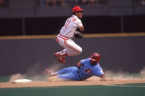 CINCINNATI, OH: Barry Larkin of the Cincinnati Reds circa 1988 turns a double play against the Philadelphia Phillies at Riverfront Stadium in Cincinnati, Ohio. (Photo by Owen C. Shaw/Getty Images)