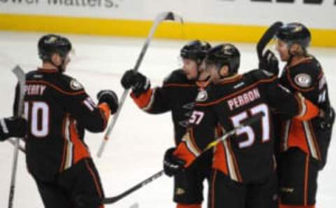 February 24, 2016; Anaheim, CA, USA; Anaheim Ducks defenseman Sami Vatanen (45) celebrates with right wing Corey Perry (10), left wing David Perron (57) and defenseman Hampus Lindholm (47) his goal scored against Buffalo Sabres during the second period at Honda Center. Mandatory Credit: Gary A. Vasquez-USA TODAY Sports