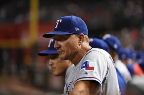 PHOENIX, AZ – JULY 31: Manager Jeff Banister #28 of the Texas Rangers looks on from the dugout during the eighth inning against the Arizona Diamondbacks at Chase Field on July 31, 2018 in Phoenix, Arizona. Diamondbacks won 6-0. (Photo by Norm Hall/Getty Images)