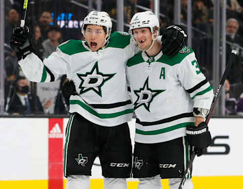 LAS VEGAS, NEVADA – DECEMBER 08: Jason Robertson #21 and John Klingberg #3 of the Dallas Stars celebrate after Klingberg assisted Robertson on a first-period power-play goal against the Vegas Golden Knights during their game at T-Mobile Arena on December 8, 2021 in Las Vegas, Nevada. (Photo by Ethan Miller/Getty Images)