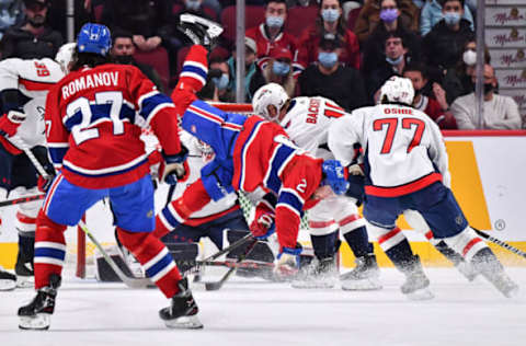 MONTREAL, QC – APRIL 16: Ryan Poehling #25 of the Montreal Canadiens falls after being hit during the first period against the Washington Capitals at Centre Bell on April 16, 2022 in Montreal, Canada. (Photo by Minas Panagiotakis/Getty Images)