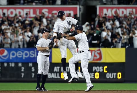 NEW YORK, NEW YORK – OCTOBER 03: Aaron Judge #99 of the New York Yankees celebrates with Brett Gardner #11 and Aaron Hicks #31 after defeating the Oakland Athletics by a score of 7-2 to win the American League Wild Card Game at Yankee Stadium on October 03, 2018 in the Bronx borough of New York City. (Photo by Al Bello/Getty Images)