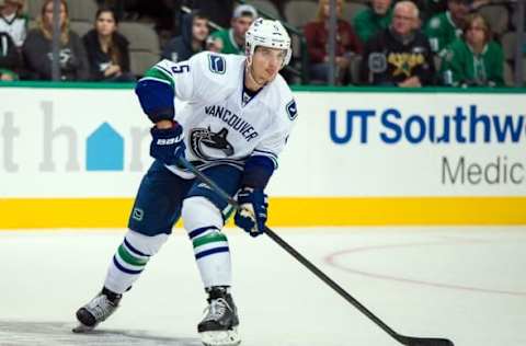 Oct 21, 2014; Dallas, TX, USA; Vancouver Canucks defenseman Luca Sbisa (5) skates against the Dallas Stars during the game at the American Airlines Center. The Stars defeated the Canucks 6-3. Mandatory Credit: Jerome Miron-USA TODAY Sports