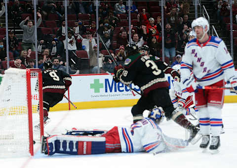 Dec 15, 2021; Glendale, Arizona, USA; Arizona Coyotes right wing Clayton Keller (9) celebrates a goal against New York Rangers goaltender Keith Kinkaid (71) during the third period at Gila River Arena. Mandatory Credit: Joe Camporeale-USA TODAY Sports