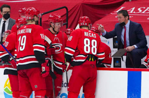 Mar 20, 2021; Raleigh, North Carolina, USA; Carolina Hurricanes head coach Rod BrindÕAmour talks to his players during a timeout against the Columbus Blue Jackets at PNC Arena. Mandatory Credit: James Guillory-USA TODAY Sports