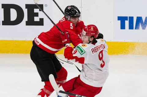 EDMONTON, AB – JANUARY 04: Thomas Harley #5 of Canada skates against Mikhail Abramov #9 of Russia during the 2021 IIHF World Junior Championship semifinals at Rogers Place on January 4, 2021 in Edmonton, Canada. (Photo by Codie McLachlan/Getty Images)