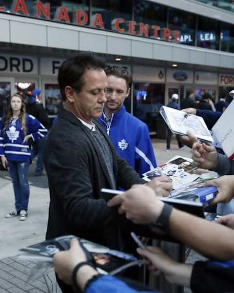 Oct 7, 2015; Toronto, Ontario, CAN; Toronto Maple Leafs former player Doug Gilmour signs autographs outside of the Air Canada Centre prior to the home opener against the Montreal Canadiens. Mandatory Credit: John E. Sokolowski-USA TODAY Sports