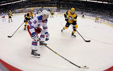 Mar 9, 2021; Pittsburgh, Pennsylvania, USA; New York Rangers left wing Chris Kreider (20) carries the puck against the Pittsburgh Penguins during the second period at PPG Paints Arena. Mandatory Credit: Charles LeClaire-USA TODAY Sports