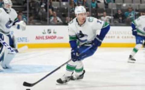 Nov 27, 2022; San Jose, California, USA; Vancouver Canucks defenseman Luke Schenn (2) skates with the puck against the San Jose Sharks during the second period at SAP Center at San Jose. Mandatory Credit: Darren Yamashita-USA TODAY Sports