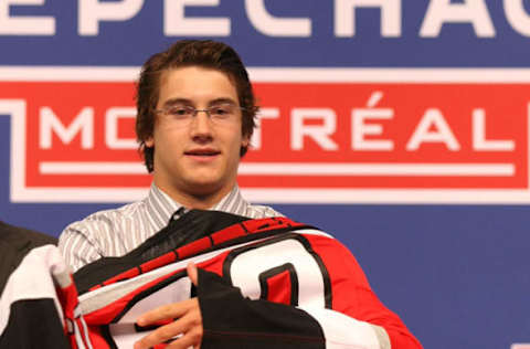 MONTREAL, QC – JUNE 26: Philippe Paradis puts on his new Carolina Hurricanes sweater after he was elected #27 overall by the Hurricanes during the first round of the 2009 NHL Entry Draft at the Bell Centre on June 26, 2009 in Montreal, Quebec, Canada. (Photo by Bruce Bennett/Getty Images)