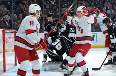 LOS ANGELES, CA – October 15: Ryan Dzingel, Warren Foegele and Erik Haula #56 of the Carolina Hurricanes celebrate the first goal during the second period against the Los Angeles Kings at STAPLES Center on October 15, 2019 in Los Angeles, California. (Photo by Juan Ocampo/NHLI via Getty Images)