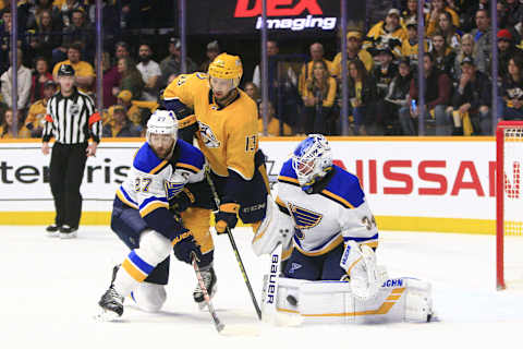 NASHVILLE, TN – FEBRUARY 10: St. Louis Blues goalie Jake Allen (34) makes a save on the deflection by Nashville Predators center Nick Bonino (13) as Blues defenseman Alex Pietrangelo (27) defends during the NHL game between the Nashville Predators and St. Louis Blues, held on February 10, 2019, at Bridgestone Arena in Nashville, Tennessee. (Photo by Danny Murphy/Icon Sportswire via Getty Images)