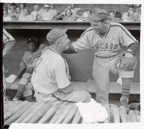 (Original Caption) During the Chicago Cubs’ series in Philadelphia, Gabby Hartnett, catcher and new manager of the Cubs took occasion to talk things over with his most temperamental player, Dizzy Dean, of the sometime,s powerful and sometimes weak pitching arm, however Gabby expects great things from the Dizzy one, especially since owner Phil Wrigley’s ultimatum to his $185,000 star. Dean is standing here taking the talking-to smilingly.