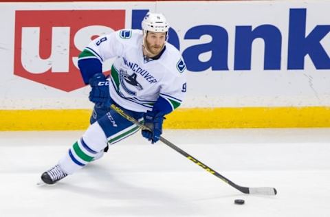 Nov 25, 2015; Saint Paul, MN, USA; Vancouver Canucks forward Brandon Prust (9) skates with the puck in the third period against the Minnesota Wild at Xcel Energy Center. The Vancouver Canucks beat the Minnesota Wild 3-2. Mandatory Credit: Brad Rempel-USA TODAY Sports