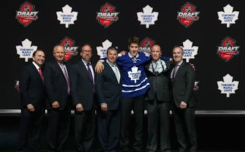 NEWARK, NJ – JUNE 30: Frederik Gauthier poses with the front office after being selected number twenty one overall in the first round by the Toronto Maple Leafs  (Photo by Bruce Bennett/Getty Images)