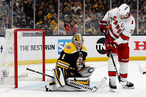 May 6, 2022; Boston, Massachusetts, USA; Boston Bruins goaltender Jeremy Swayman (1) makes a save as Carolina Hurricanes center Jordan Staal (11) looks for the rebound during the first period in game three of the first round of the 2022 Stanley Cup Playoffs at TD Garden. Mandatory Credit: Winslow Townson-USA TODAY Sports