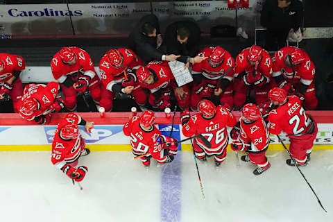 Apr 17, 2023; Raleigh, North Carolina, USA; Carolina Hurricanes head coach Rod Brind’Amour talks to the players during a timeout against the New York Islanders during the third period in game one of the first round of the 2023 Stanley Cup Playoffs at PNC Arena. Mandatory Credit: James Guillory-USA TODAY Sports