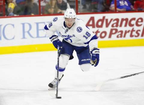 Feb 21, 2016; Raleigh, NC, USA; Tampa Bay Lightning forward Ondrej Palat (18) skates with the puck against the Carolina Hurricanes at PNC Arena. The Tampa Bay Lightning defeated the Carolina Hurricanes 4-2. Mandatory Credit: James Guillory-USA TODAY Sports