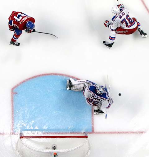 Apr 20, 2017; Montreal, Quebec, CAN; New York Rangers goalie Henrik Lundqvist (30) makes a save against Montreal Canadiens and defenseman Brady Skjei (76) and left wing Max Pacioretty (67) during the third period in game five of the first round of the 2017 Stanley Cup Playoffs at Bell Centre. Mandatory Credit: Jean-Yves Ahern-USA TODAY Sports