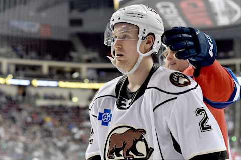 HERSHEY, PA – DECEMBER 01: A Springfield player grabs Hershey Bears defenseman Tyler Lewington (2) after a whistle during the Springfield Thunderbirds at Hershey Bears on December 1, 2018 at the Giant Center in Hershey, PA. (Photo by Randy Litzinger/Icon Sportswire via Getty Images)