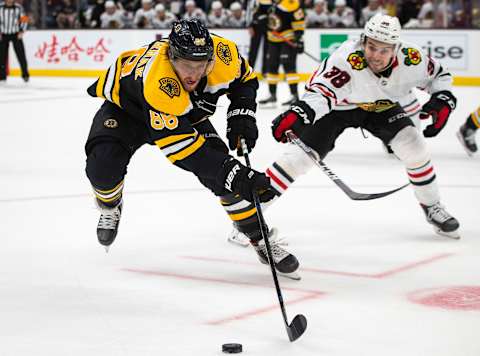 BOSTON – SEPTEMBER 28: Boston Bruins right wing David Pastrnak (88) goes after the puck during the third period. The Boston Bruins host the Chicago Blackhawks in their final pre-season NHL hockey game at TD Garden in Boston on Sep. 28, 2019. (Photo by Nic Antaya for The Boston Globe via Getty Images)