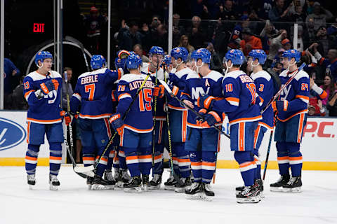 UNIONDALE, NY – DECEMBER 05: The New York Islanders celebrate the victory after the overtime period of the National Hockey League game between the Las Vegas Golden Knights and the New York Islanders on December 5, 2019, at the Nassau Veterans Memorial Coliseum in Uniondale, NY. (Photo by Gregory Fisher/Icon Sportswire via Getty Images)