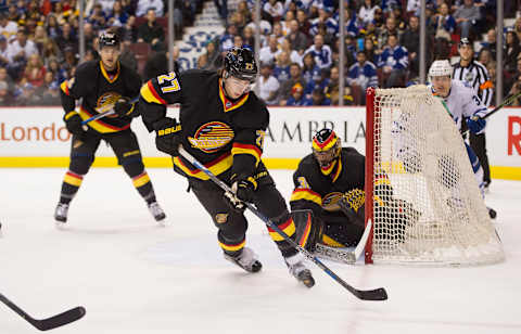 VANCOUVER, BC – FEBRUARY 13: Ben Hutton #27 of the Vancouver Canucks skates with the puck in NHL action against the Toronto Maple Leafs on February, 13, 2016 at Rogers Arena in Vancouver, British Columbia, Canada. (Photo by Rich Lam/Getty Images)