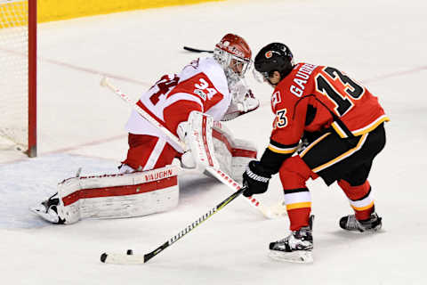 Mar 3, 2017; Calgary, Alberta, CAN; Calgary Flames left wing Johnny Gaudreau (13) tries to score against Detroit Red Wings goalie Petr Mrazek (34) during overtime at Scotiabank Saddledome. The Flames won 3-2 in overtime. Mandatory Credit: Candice Ward-USA TODAY Sports