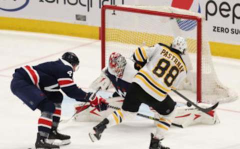 Apr 8, 2021; Washington, District of Columbia, USA; Washington Capitals goaltender Ilya Samsonov (30) makes a save on Boston Bruins right wing David Pastrnak (88) in the third period at Capital One Arena. Mandatory Credit: Geoff Burke-USA TODAY Sports