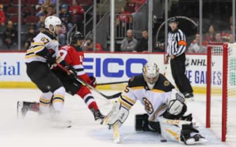 Sep 16, 2019; Newark, NJ, USA; Boston Bruins goaltender Kyle Keyser (85) makes a save on New Jersey Devils center Travis Zajac (19) during the second period at Prudential Center. Mandatory Credit: Ed Mulholland-USA TODAY Sports