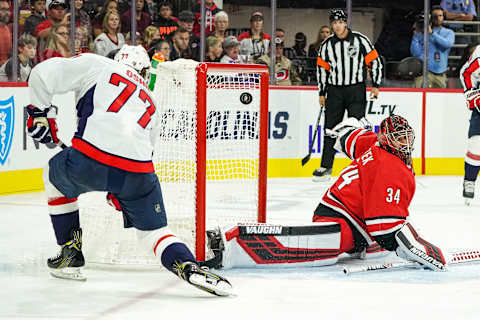 RALEIGH, NC – SEPTEMBER 29: Washington Capitals right wing T.J. Oshie (77) misses a shot on an open net in front of Carolina Hurricanes goaltender Petr Mrazek (34) during an NHL Preseason game between the Washington Capitals and the Carolina Hurricanes on September 29, 2019 at the PNC Arena in Raleigh, NC. (Photo by Greg Thompson/Icon Sportswire via Getty Images)