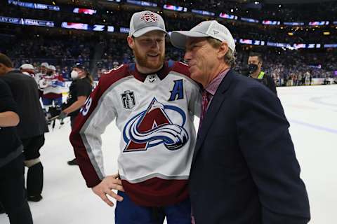 TAMPA, FLORIDA – JUNE 26: Nathan MacKinnon #29 of the Colorado Avalanche talks with General Manager Joe Sakic after defeating the Tampa Bay Lightning 2-1 in Game Six of the 2022 NHL Stanley Cup Final at Amalie Arena on June 26, 2022 in Tampa, Florida. (Photo by Bruce Bennett/Getty Images)