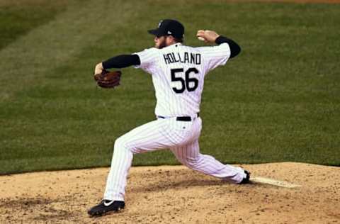 Apr 11, 2017; Denver, CO, USA; Colorado Rockies relief pitcher Greg Holland (56) delivers a pitch against the San Diego Padres in the ninth inning at Coors Field. The Rockies defeated the Padres 3-2. Mandatory Credit: Ron Chenoy-USA TODAY Sports. MLB.